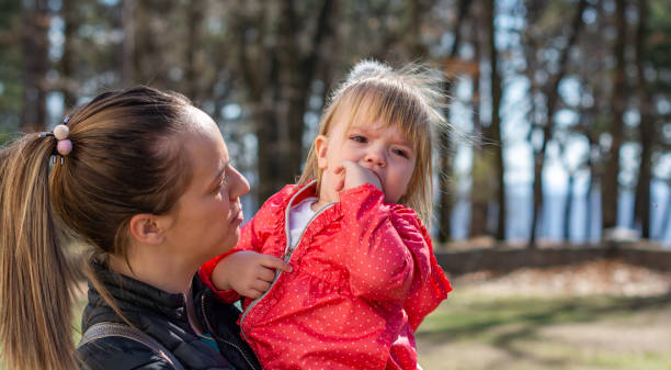 istock Crying baby in mother's arms 1141772314
