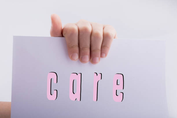 istock Hand holding paper with care wording 1141772326