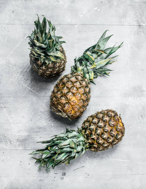 istock Fresh ripe pineapple with leaves. 1141772373