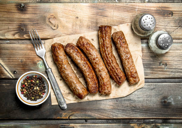 istock Grill sausages on paper . 1141772439