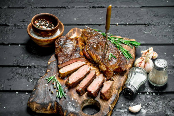 istock Grilled beef steak with rosemary and spices. 1141772583
