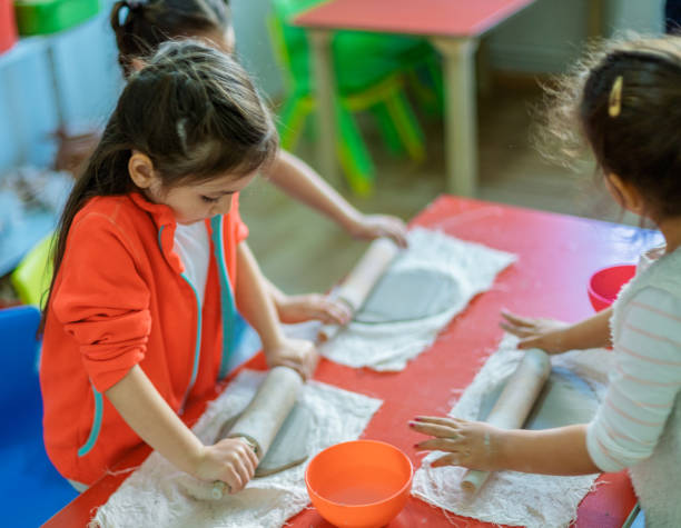 istock Cute Little Girls making Cremic 1141773525