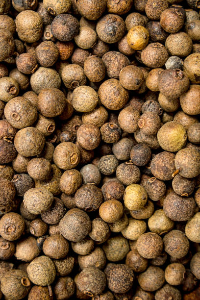 istock Peas of fragrant black pepper. 1141774548