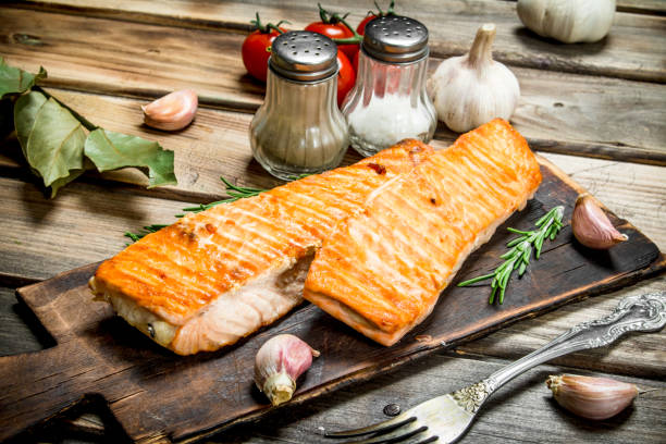istock Grilled salmon fillet with spices and herbs. 1141774656