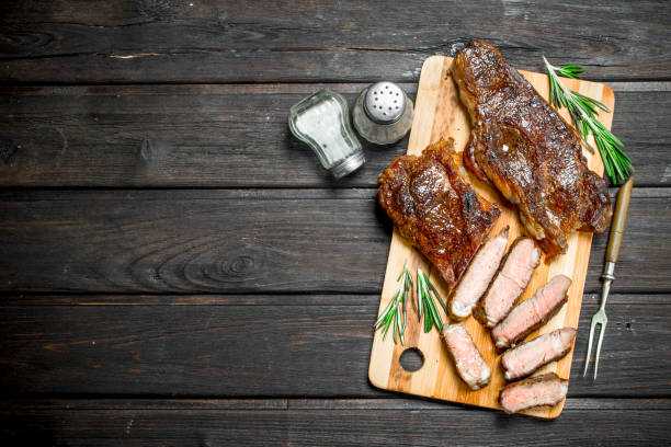 istock Grilled beef steak with herbs and spices. 1141774957