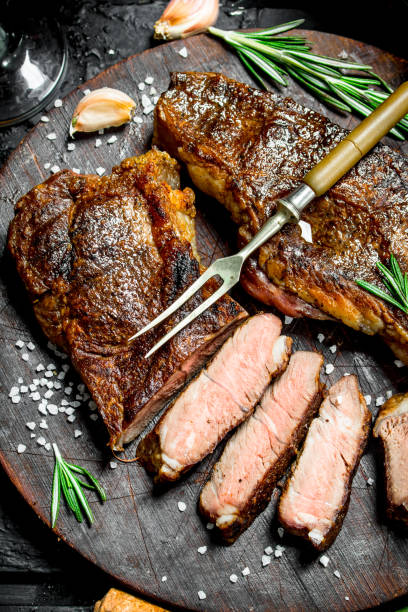 istock Grilled beef steak with rosemary and spices. 1141774961