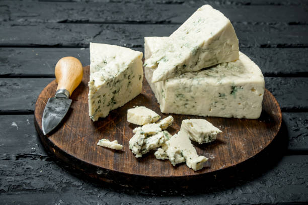 istock Blue cheese on a wooden Board with a knife. 1141775818