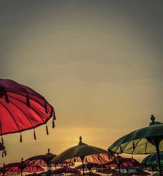 Tropical sunset with quaint colorful umbrellas