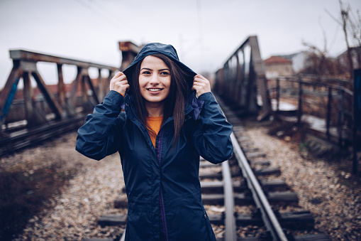 Cute brunette in the rainy day, walking and enjoying the day  the city.