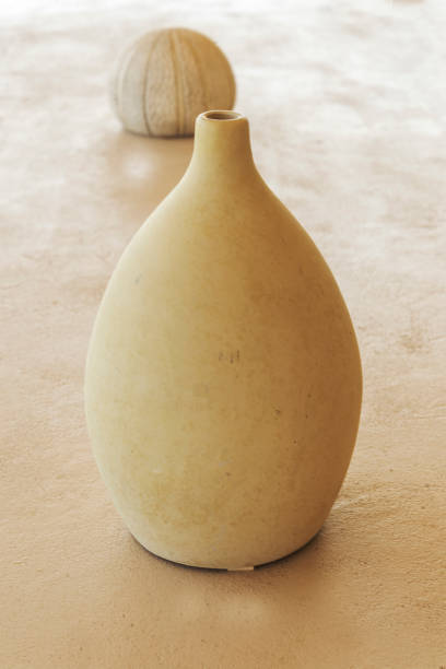 istock cream vertical ceramic vase on the table 1141779782