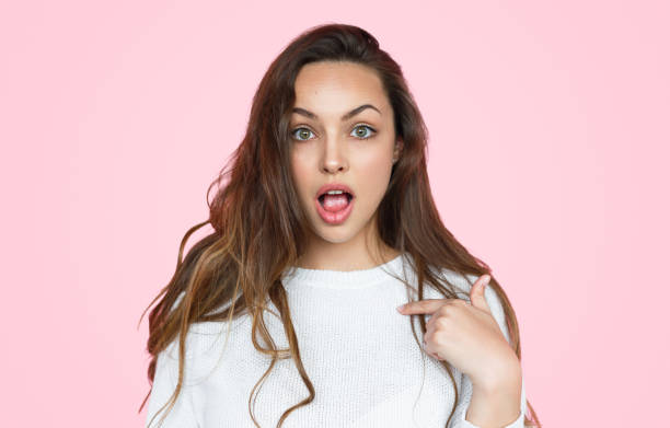 istock Astonished female pointing at herself 1141779869