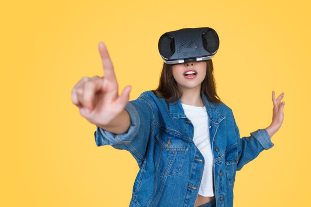 istock Woman in VR glasses pushing button 1141779908