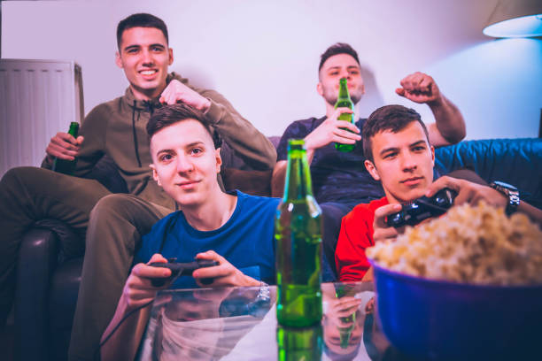 istock Cheerful friends playing video game 1141781072