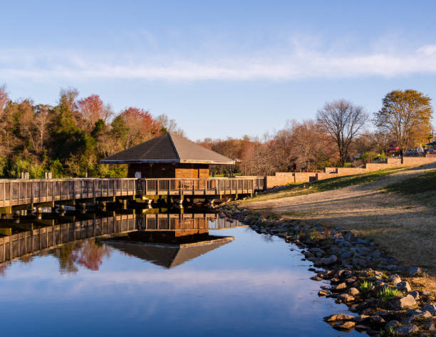 Cabin Overlooking the Lake A wooden cabin built over Lake Fairfax is reflected in the water below. fairfax virginia photos stock pictures, royalty-free photos & images