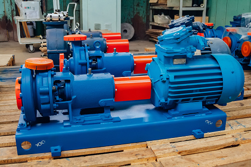 New finished electric water pump in factory warehouse.