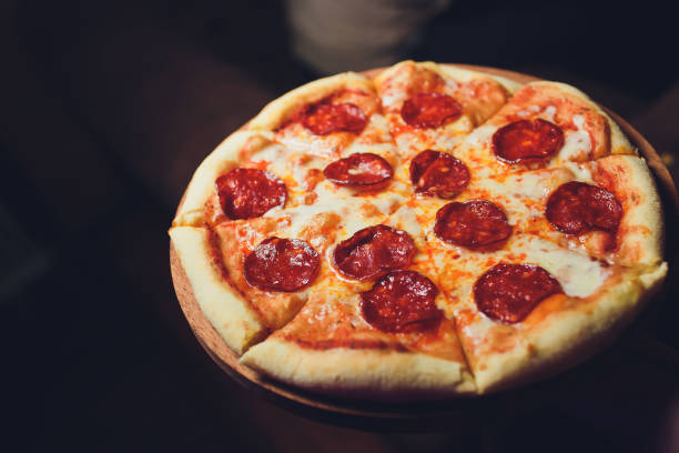 istock Top view tasty italian pizza on dark background. 1141790133