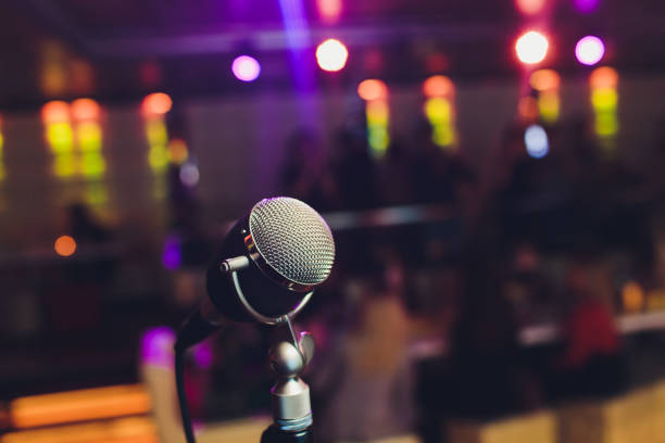 istock Microphone. Retro microphone. A microphone on stage. A pub. Bar. Restaurant. Classic. Evening. Night show. European restaurant. European bar. American restaurant. American bar. 1141791942