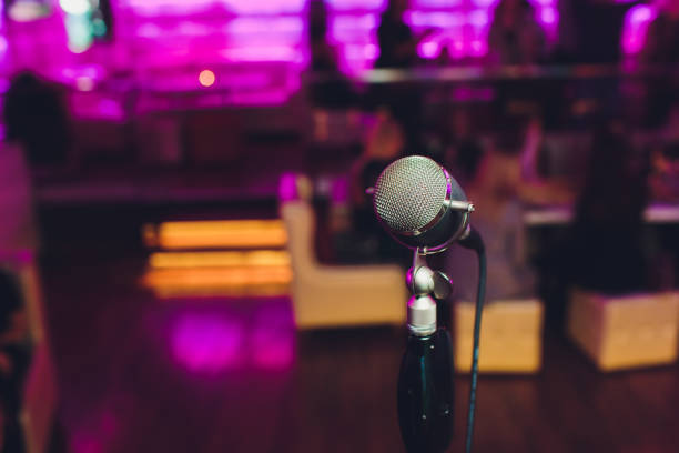 istock Microphone. Retro microphone. A microphone on stage. A pub. Bar. Restaurant. Classic. Evening. Night show. European restaurant. European bar. American restaurant. American bar. 1141791959