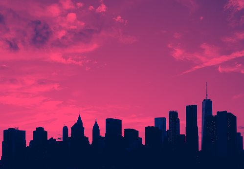 New York City skyline buildings and empty sky above with pink and blue color cast effect