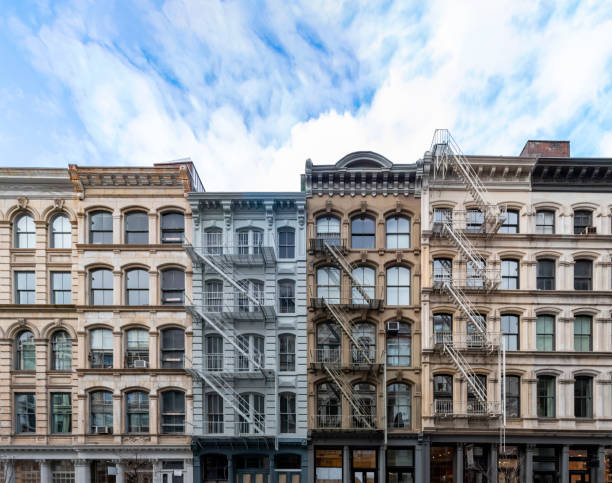 exterior view of old apartment buildings in the soho neighborhood of manhattan in new york city - nobody old architecture urban scene imagens e fotografias de stock