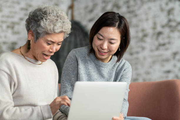 istock Adult Daughter Teaching Her Mother How to Use A Computer 1141793727