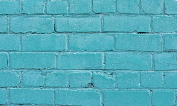 istock Texture of old blue brick wall surface with cement seams 1141793862