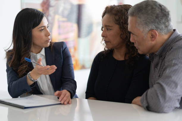 Ethnic Senior Couple With Financial Advisor