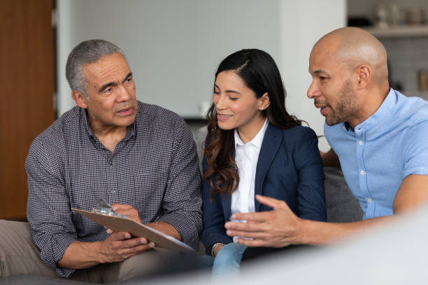 istock Male Financial Advisor Talking To Clients 1141794011