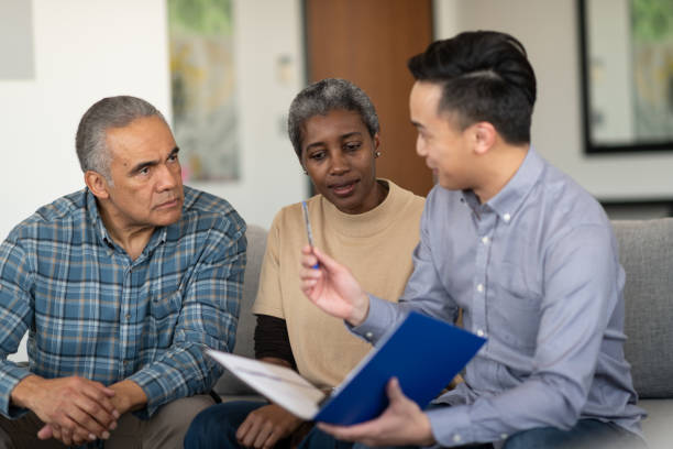 istock Ethnic Senior Couple With Financial Advisor 1141794014
