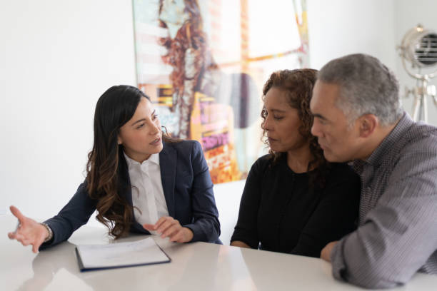 istock Ethnic Senior Couple With Financial Advisor 1141794016