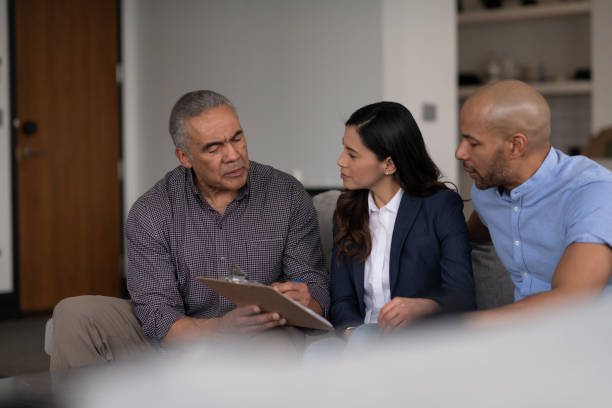 istock Male Financial Advisor Talking To Clients 1141794028