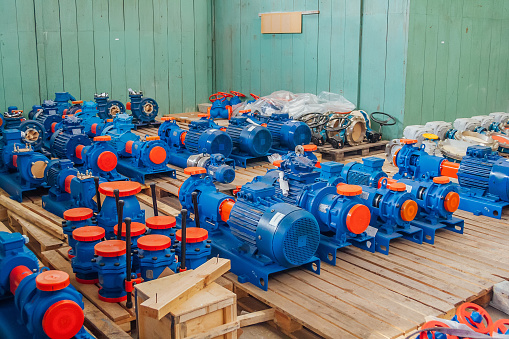 New finished electric water pumps in factory warehouse.