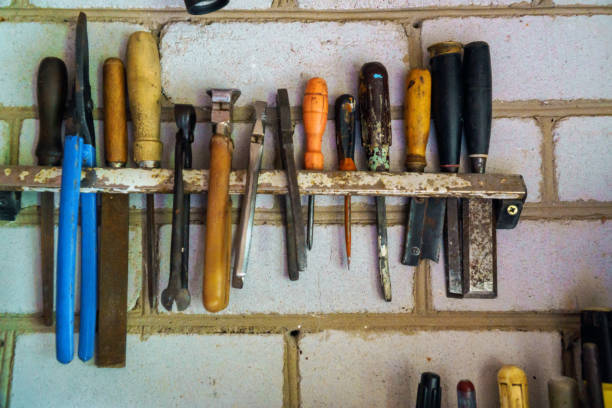istock tools in labor day and business fight crafting tools on a work table. 1141807322