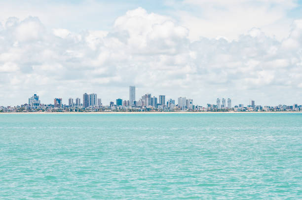 Praia do Bessa and the city of Joao Pessoa PB Brazil Bessa beach seen from the middle of the sea. Buildings by the sea at Praia do Bessa and the city of Joao Pessoa PB Brazil. paraiba photos stock pictures, royalty-free photos & images