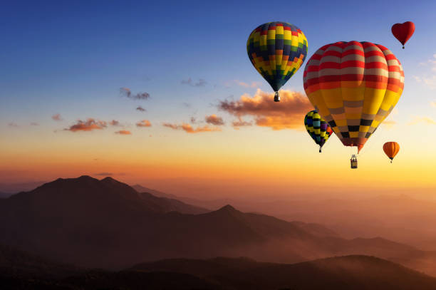 Hot air balloons with landscape mountain. Beautiful colorful hot air balloons flying over mountain at view point Sunset of travel place, Doi inthanon, Chiang mai's Hidden Paradise in Thailand. hot air balloon stock pictures, royalty-free photos & images