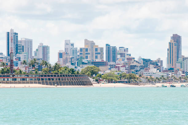 View of Praia de Tambau beach and the city on background at Joao Pessoa PB Brazil. Touristic beach of Brazilian northeast. View from the sea to the city.