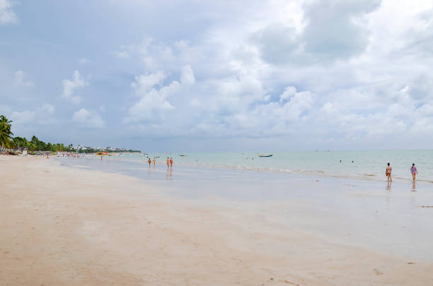 Cabedelo - PB, Brazil - February 23, 2019: Local people and tourists enjoying the day at Ponta de Campina beach. Cabedelo PB Brazil. Northeastern Brazilian beach.
