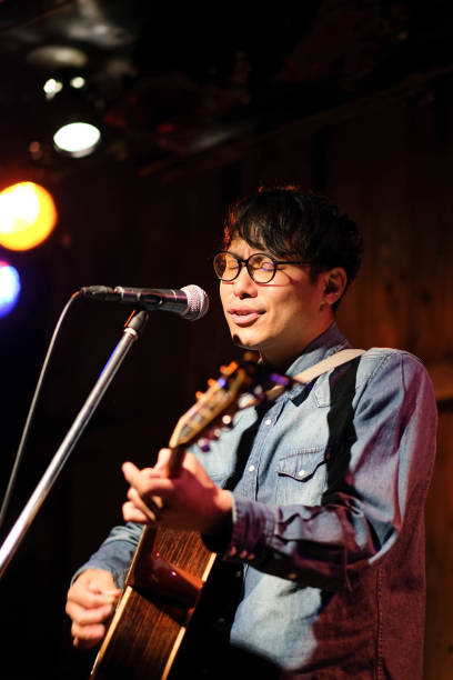 istock Singer singing songs on stage 1141814075