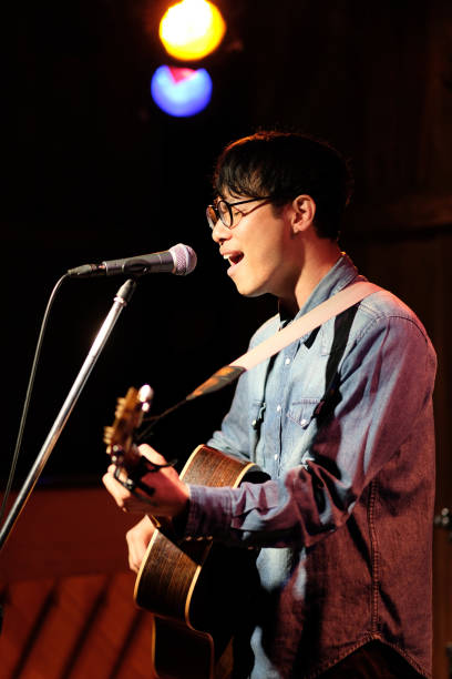 istock Singer singing songs on stage 1141814272