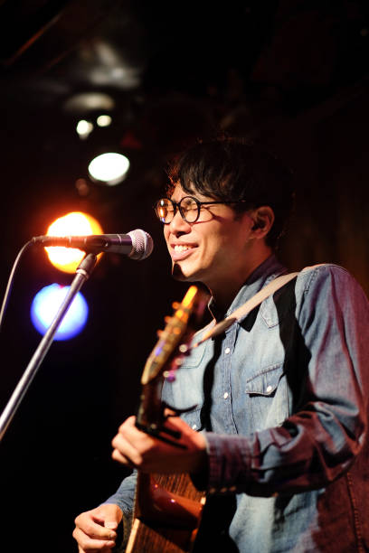 istock Singer singing songs on stage 1141814278