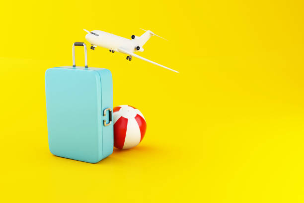 istock 3d Travel suitcase, airplane and beach ball 1141814423