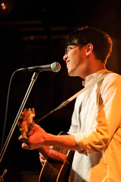 istock Singer singing songs on stage 1141815082