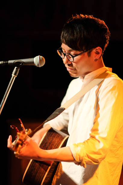 istock Singer singing songs on stage 1141815083