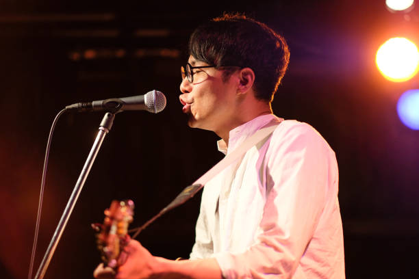 istock Singer singing songs on stage 1141815156