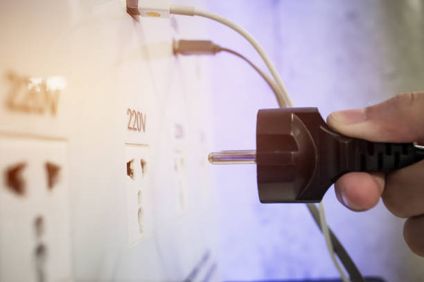 Hand connecting electrical power plug, Usb charger socket wall plug for charging smartphone or computer connect for providing tourists and travelers at Airport.