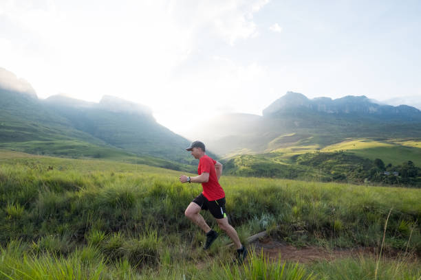 istock Man runs along a hiking trail in the mountains 1141818795