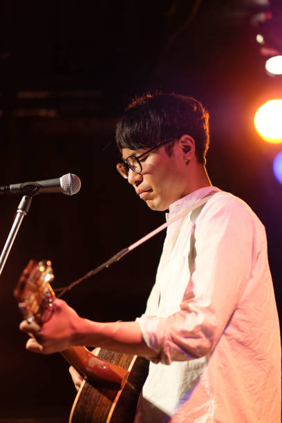 istock Singer singing songs on stage 1141821638
