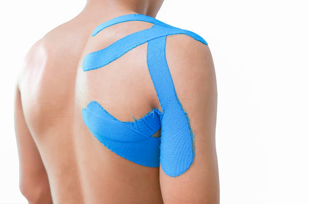 Man with kinesiotaping on the shoulder stock photo