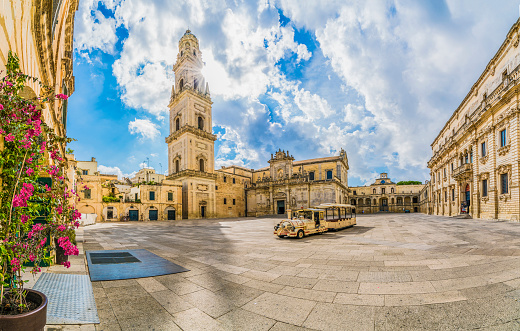 Lecce, Italy - August 13, 2018: Piazza del Duomo square and Virgin Mary Cathedral in Lecce, Puglia region, southern Italy