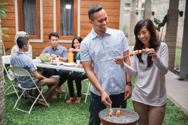 istock asian people barbecue with friends 1141824533